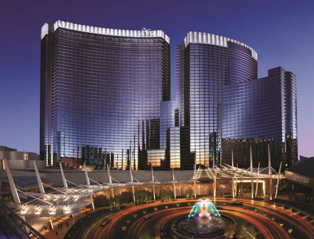 Exterior view of the modern Aria Resort & Casino at dusk, a top wheelchair accessible hotel in Las Vegas.